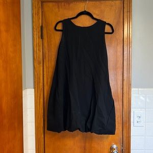 COS black dress size small with fun skirt bottom. Good condition